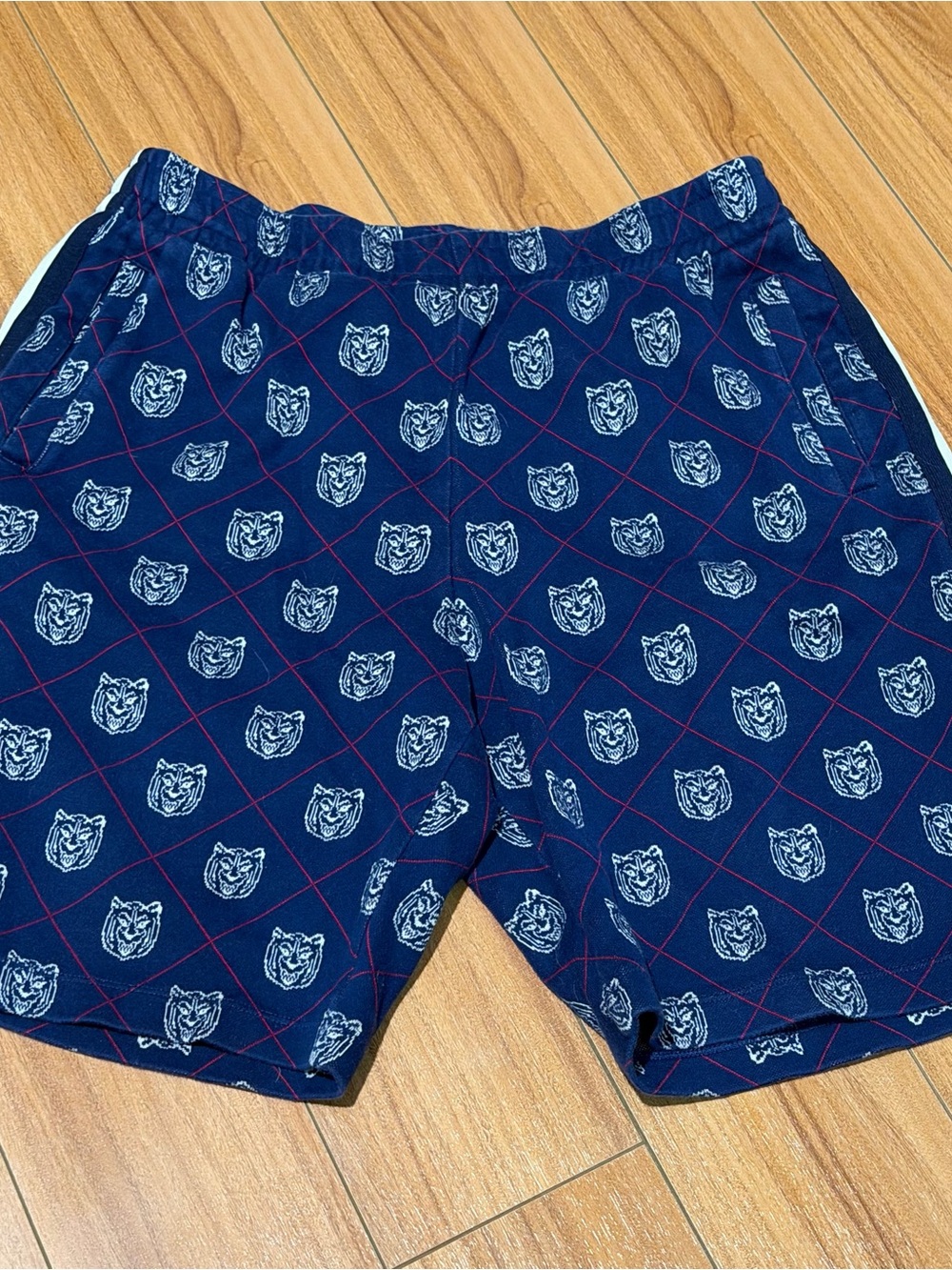 Gucci Navy Blue Shorts with White Crest Motifs and Red Stitching